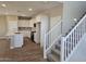 Bright kitchen with white cabinets, tiled backsplash and stainless steel appliances at 3372 S 180Th Ln, Goodyear, AZ 85338