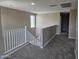 Spacious carpeted loft area with staircase and natural light at 3372 S 180Th Ln, Goodyear, AZ 85338
