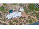 Luxury home with a private pool, desert landscaping, and a long driveway, offering an exclusive desert oasis at 35180 N Boulder Pass, Scottsdale, AZ 85266