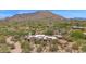 Expansive aerial view of home, nestled in desert landscaping at 35180 N Boulder Pass, Scottsdale, AZ 85266