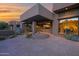 Exterior features a covered patio with outdoor seating area and desert landscaping at 35180 N Boulder Pass, Scottsdale, AZ 85266