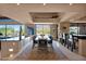 Open concept dining room with art and seating area and desert mountain views at 35180 N Boulder Pass, Scottsdale, AZ 85266
