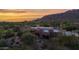 Stunning home exterior with desert landscaping and mountain views at sunset at 35180 N Boulder Pass, Scottsdale, AZ 85266
