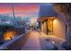 A desert home exterior with landscape lighting and native desert vegetation at 35180 N Boulder Pass, Scottsdale, AZ 85266
