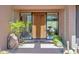 Modern front door with sidelights and manicured desert landscaping at 35180 N Boulder Pass, Scottsdale, AZ 85266