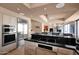 Modern kitchen featuring stainless steel appliances and bar seating, blending functionality with style at 35180 N Boulder Pass, Scottsdale, AZ 85266