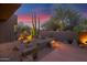Lush landscaping features a variety of cacti, boulders, and walkway lighting at 35180 N Boulder Pass, Scottsdale, AZ 85266
