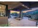 Outdoor living area with stone patio, desert landscaping, and mountain views at 35180 N Boulder Pass, Scottsdale, AZ 85266