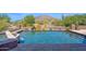 Beautiful pool and spa surrounded by lush desert landscaping with a mountain backdrop, creating a serene oasis at 35180 N Boulder Pass, Scottsdale, AZ 85266