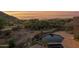 Beautiful home pool with desert views surrounded by lush desert landscaping at 35180 N Boulder Pass, Scottsdale, AZ 85266