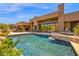 Exceptional outdoor living with a pool, spa, desert landscape, and architectural details enhancing this property's appeal at 35180 N Boulder Pass, Scottsdale, AZ 85266