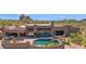 Backyard oasis featuring a pool, spa, and desert landscape at 35180 N Boulder Pass, Scottsdale, AZ 85266