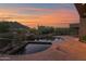Inviting backyard pool with natural desert landscaping offers a serene and luxurious outdoor living space at 35180 N Boulder Pass, Scottsdale, AZ 85266