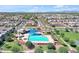 Community featuring a swimming pool, manicured landscaping, and residential properties at 3634 E Perkinsville St, Gilbert, AZ 85295