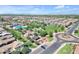 Aerial view showcasing a community park with a pool, playground, and green spaces at 3634 E Perkinsville St, Gilbert, AZ 85295