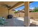 Covered back patio with ceiling fan, table and chairs at 3634 E Perkinsville St, Gilbert, AZ 85295