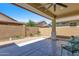 Spacious backyard with covered patio, planter boxes, and a brick wall for added privacy at 3634 E Perkinsville St, Gilbert, AZ 85295