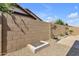 Private backyard featuring gravel landscaping, brick fence, and plant boxes at 3634 E Perkinsville St, Gilbert, AZ 85295