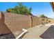 Private backyard featuring gravel landscaping, block fence, and plant boxes perfect for outdoor living at 3634 E Perkinsville St, Gilbert, AZ 85295