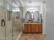 Bathroom features a glass shower, dual sinks, granite countertops, and stylish mirrors at 3634 E Perkinsville St, Gilbert, AZ 85295