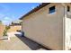 Exterior view showing stucco wall, gravel landscaping, and view of back patio at 3634 E Perkinsville St, Gilbert, AZ 85295