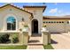 Charming single-story home with brick driveway, arched entrance and desert landscaping at 3634 E Perkinsville St, Gilbert, AZ 85295