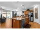 Bright kitchen open to dining features a spacious island, stainless appliances, and ample counter space at 3634 E Perkinsville St, Gilbert, AZ 85295