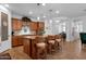Open kitchen features granite counters, a central island with bar seating and stainless steel appliances at 3634 E Perkinsville St, Gilbert, AZ 85295
