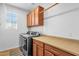 Bright laundry room with lots of cabinet space, countertops, and modern washer/dryer at 3634 E Perkinsville St, Gilbert, AZ 85295