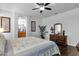 Bright main bedroom showcasing a dresser, ensuite bathroom, and neutral decor at 3634 E Perkinsville St, Gilbert, AZ 85295