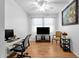 Bright office space with a ceiling fan, tile floors, large picture window and a computer desk at 3634 E Perkinsville St, Gilbert, AZ 85295