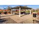 Covered picnic area with picnic tables, benches, and a barbecue grill at 3634 E Perkinsville St, Gilbert, AZ 85295
