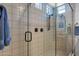 Modern glass shower with rain shower head, tiled walls, and bronzed hardware at 3634 E Perkinsville St, Gilbert, AZ 85295