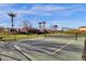 Tennis courts surrounded by landscaping and palm trees at 3634 E Perkinsville St, Gilbert, AZ 85295