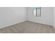 This bedroom features carpet flooring and a window with blinds at 37735 W Santa Maria St, Maricopa, AZ 85138