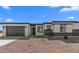 Charming single-story home with desert landscaping, stone accents, and attached two-car garage at 37735 W Santa Maria St, Maricopa, AZ 85138