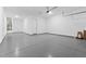 Attached two car garage featuring sealed concrete flooring at 37735 W Santa Maria St, Maricopa, AZ 85138