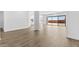 Large living area with tile flooring, sliding glass doors, and a neutral color palette at 37735 W Santa Maria St, Maricopa, AZ 85138