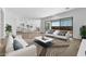 Spacious living room with an open concept to the kitchen, light colors and natural light at 37735 W Santa Maria St, Maricopa, AZ 85138