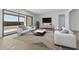 Bright living room with a large sliding door, modern decor, and minimalist design at 37735 W Santa Maria St, Maricopa, AZ 85138