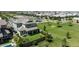 Drone view of a home with a lush backyard, patio, and easy access to the neighborhood park at 3818 E Appaloosa Rd, Gilbert, AZ 85296