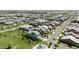 A sprawling aerial view showcases the neighborhood's layout, including a home with pool and well-kept lawns at 3818 E Appaloosa Rd, Gilbert, AZ 85296