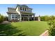 A beautiful backyard with an expansive lawn and a covered patio, perfect for relaxing or entertaining at 3818 E Appaloosa Rd, Gilbert, AZ 85296