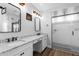 Stylish bathroom with dual vanities, granite counters, shower, and modern design at 3818 E Appaloosa Rd, Gilbert, AZ 85296