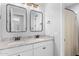 Modern bathroom with double sinks, granite countertops, and sleek fixtures at 3818 E Appaloosa Rd, Gilbert, AZ 85296