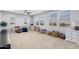 Spacious bonus room with plush carpet, ceiling fan, and ample natural light from large windows at 3818 E Appaloosa Rd, Gilbert, AZ 85296