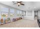 Bright bonus room with carpet, lots of natural light, and an entertainment center at 3818 E Appaloosa Rd, Gilbert, AZ 85296