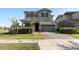 Charming two-story home featuring a brick driveway, attached two car garage, and lush green lawn at 3818 E Appaloosa Rd, Gilbert, AZ 85296