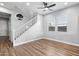 Staircase and landing area with wood-look floors and gray walls at 3818 E Appaloosa Rd, Gilbert, AZ 85296