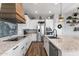 Modern kitchen with stainless steel appliances, white cabinets, and a large granite countertop island at 3818 E Appaloosa Rd, Gilbert, AZ 85296